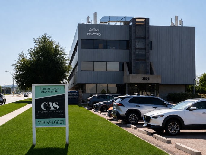 College Pharmacy building with a Colorado Asset Solutions management sign in the foreground.